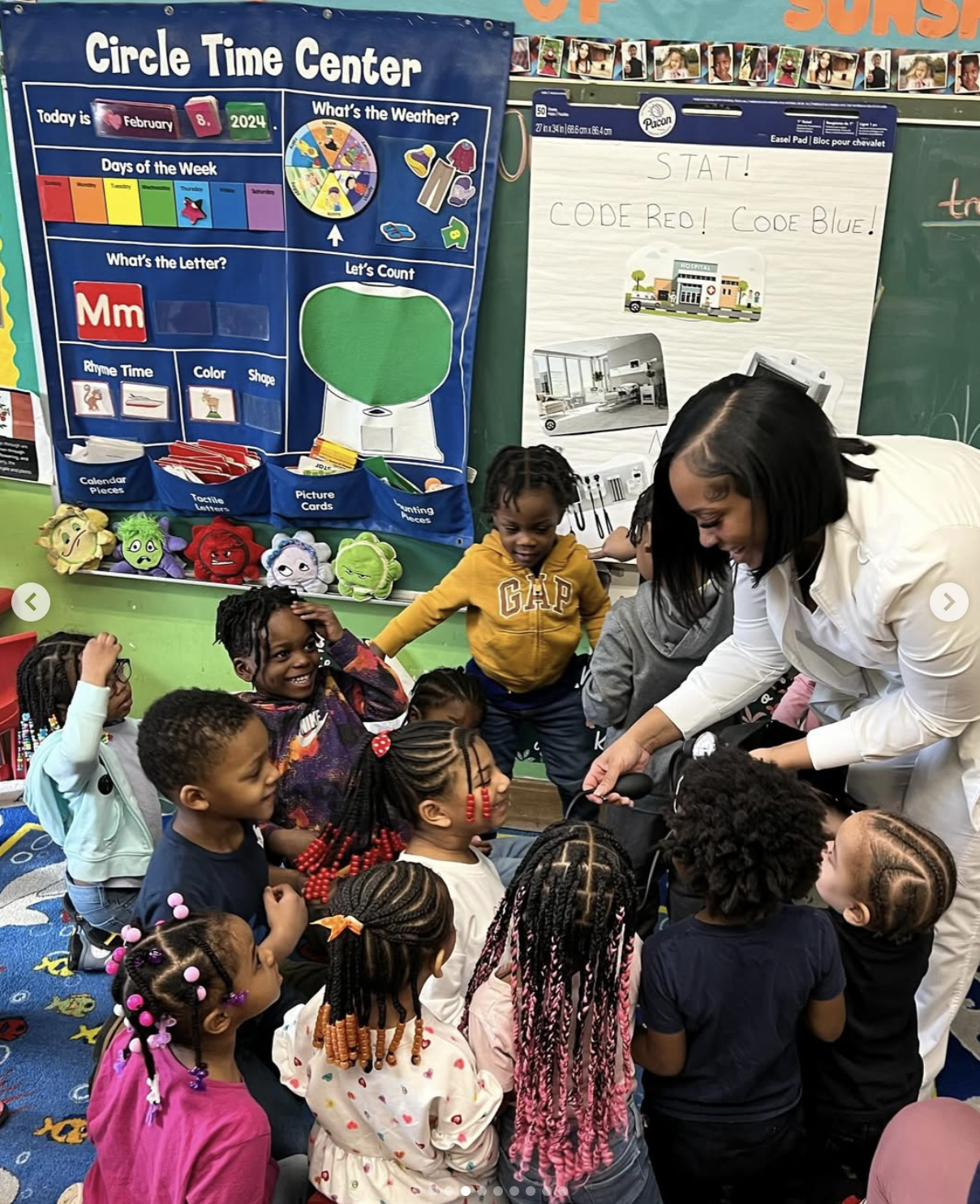 A teacher leading a busy circle time classroom