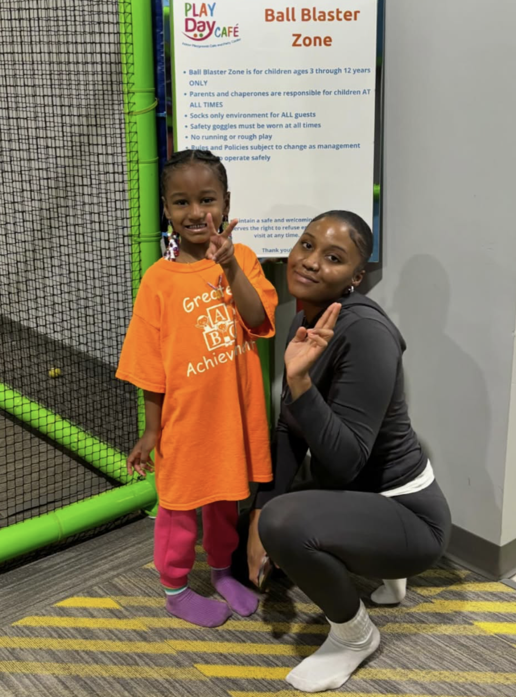 A student and teacher at Play Day Cafe