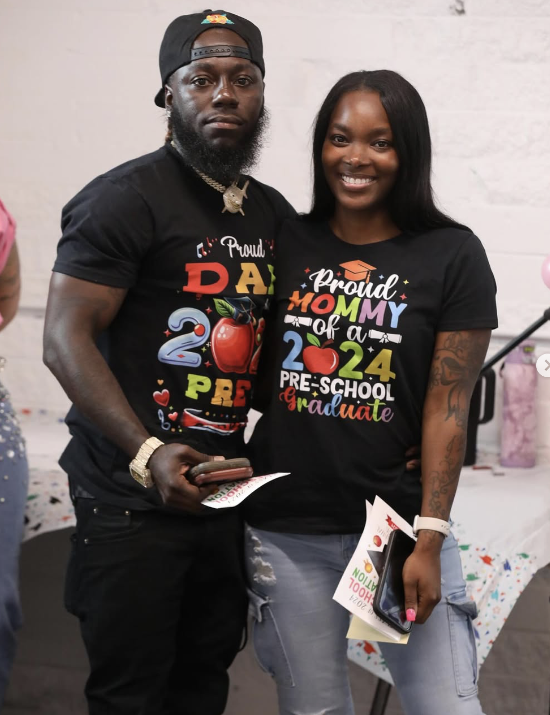 Proud parents at a preschool graduation